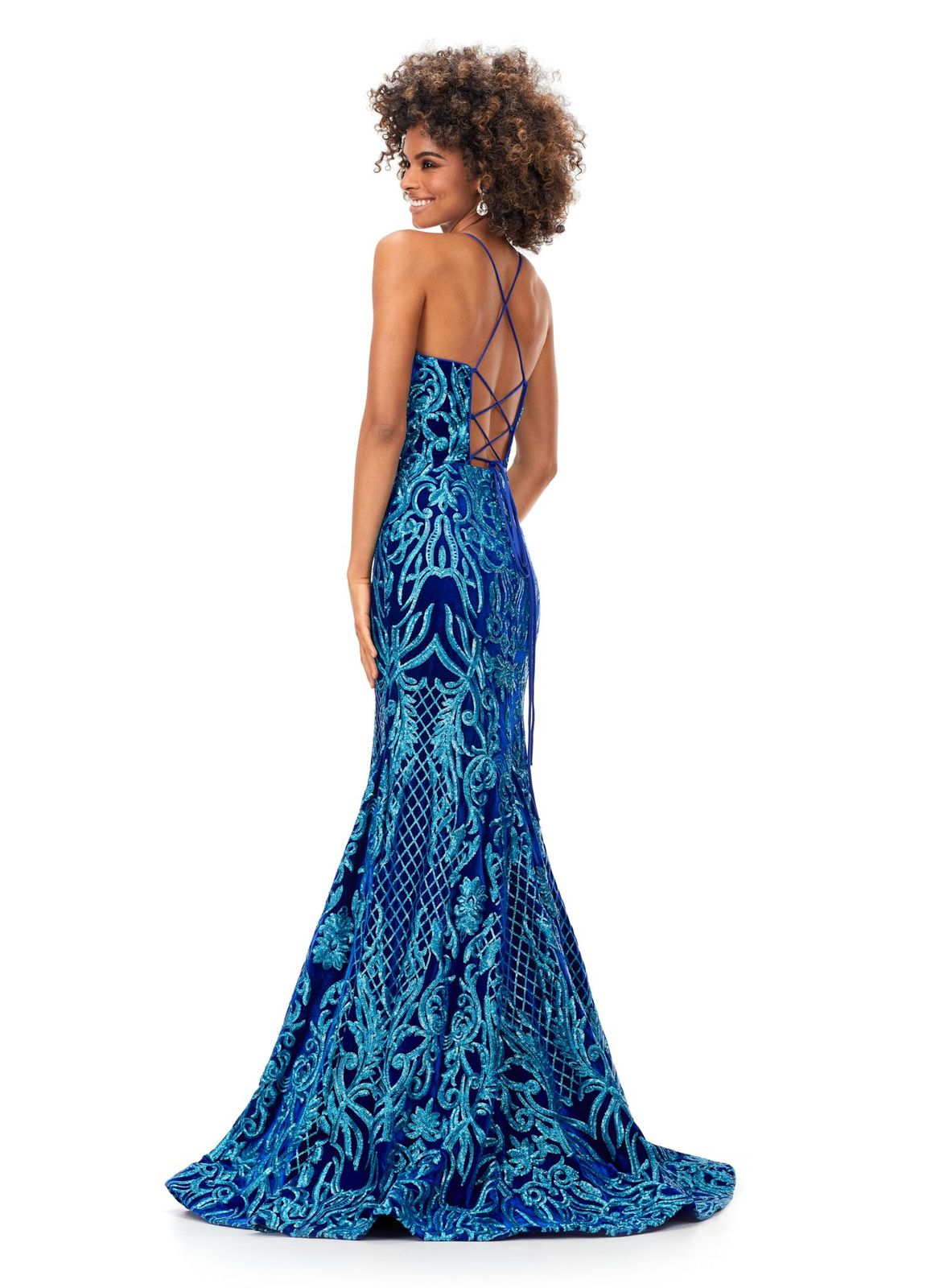 Ashley Lauren 11331 Make an entrance in this velvet sequin gown. The spaghetti straps are sure to provide the perfect fit. The sequin applique is perfectly placed throughout the gown to compliment your curves. The look is complete with a sweep train. Spaghetti Straps Lace Up Back Sweep Train Velvet Sequin COLORS: Blue, Fuchsia/Black, Turquoise/Royal