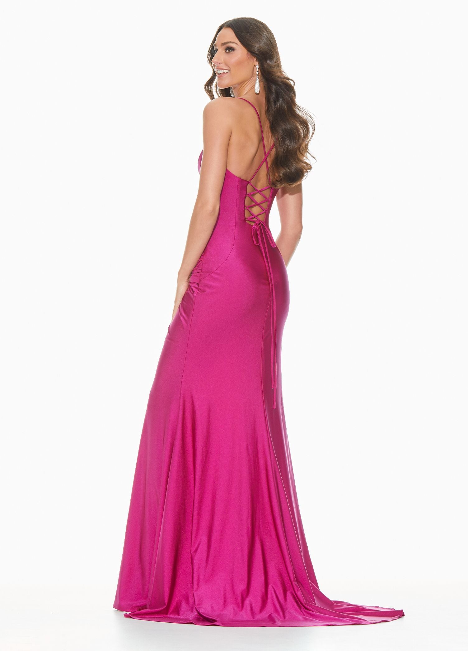 Ashley Lauren 11040 Wow in this chic evening gown with a lace up back and twist knot detail. The hip on this prom dress is adorned with a twist knot detail that gives way to a right leg slit. The skirt on this pageant dress is finished with a sweeping train.  Colors  Rose, Raspberry, Black, Royal  Sizes  0, 2, 4, 6, 8, 10, 12, 14, 16, 18  Spaghetti Straps Twist Knot Detail Slit Lace up Back Jersey