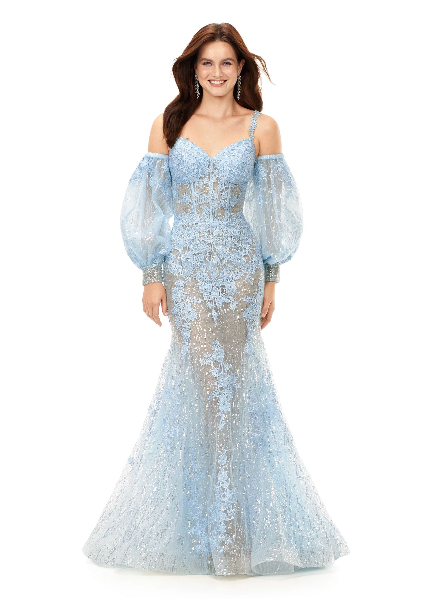 Ashley Lauren 11335 This stunning spaghetti strap sequin applique gown with appliques features an illusion corset bodice. The look is complete with a trumpet skirt and detachable puff sleeves. Spaghetti Straps Open Back Detachable Puff Sleeves Sequin Applique COLORS: Lilac, Sky