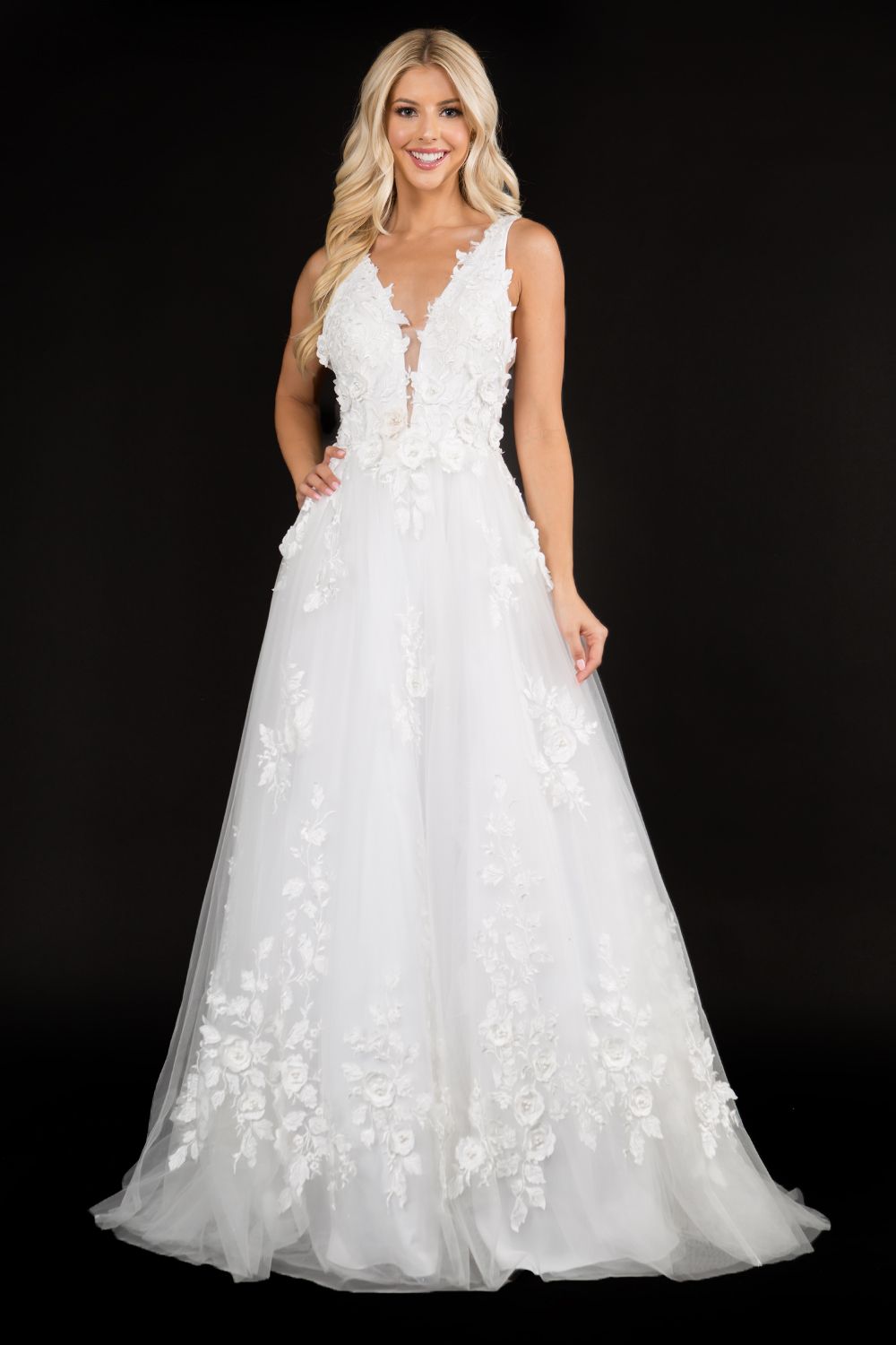 Nina Canacci 1495 is a long 3d Floral Applique embellished Deep V Neck Prom Dress. This Romantic formal gown features embellished floral appliques cascading into the tulle A Line Ballgown Skirt. Great Formal dress.  Available Sizes: 0-10  Available Colors: Ice Blue, Ivory